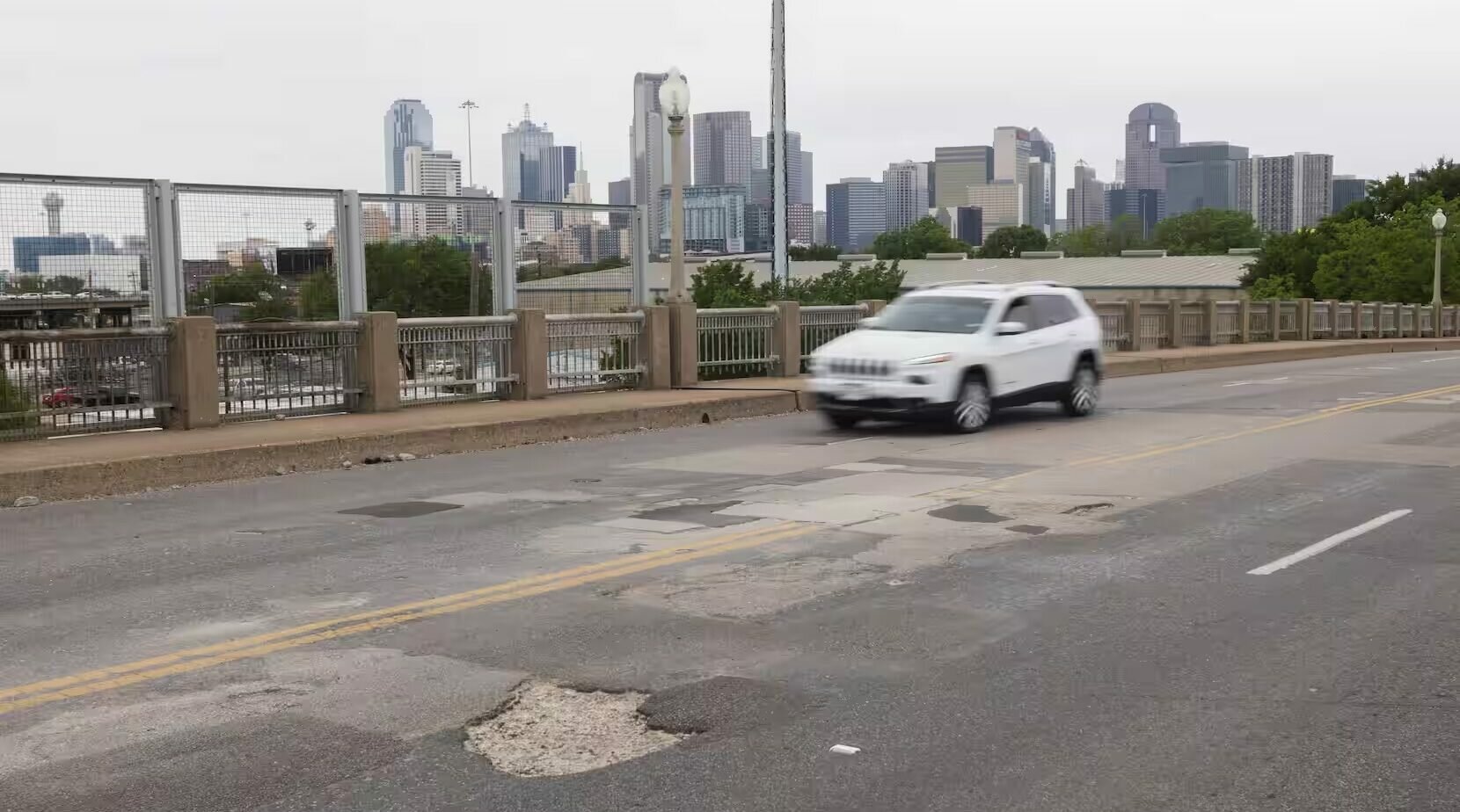 Vehicles drive over the Malcolm X Boulevard bridge on Friday, April 19, 2024, in Dallas. More than $521 million is proposed to go toward Dallas street and transportation projects in the proposed 2024 bond program, including almost $12.8 million in repairs to the Malcolm X Boulevard bridge over a DART railyard.(Juan Figueroa / Staff Photographer)